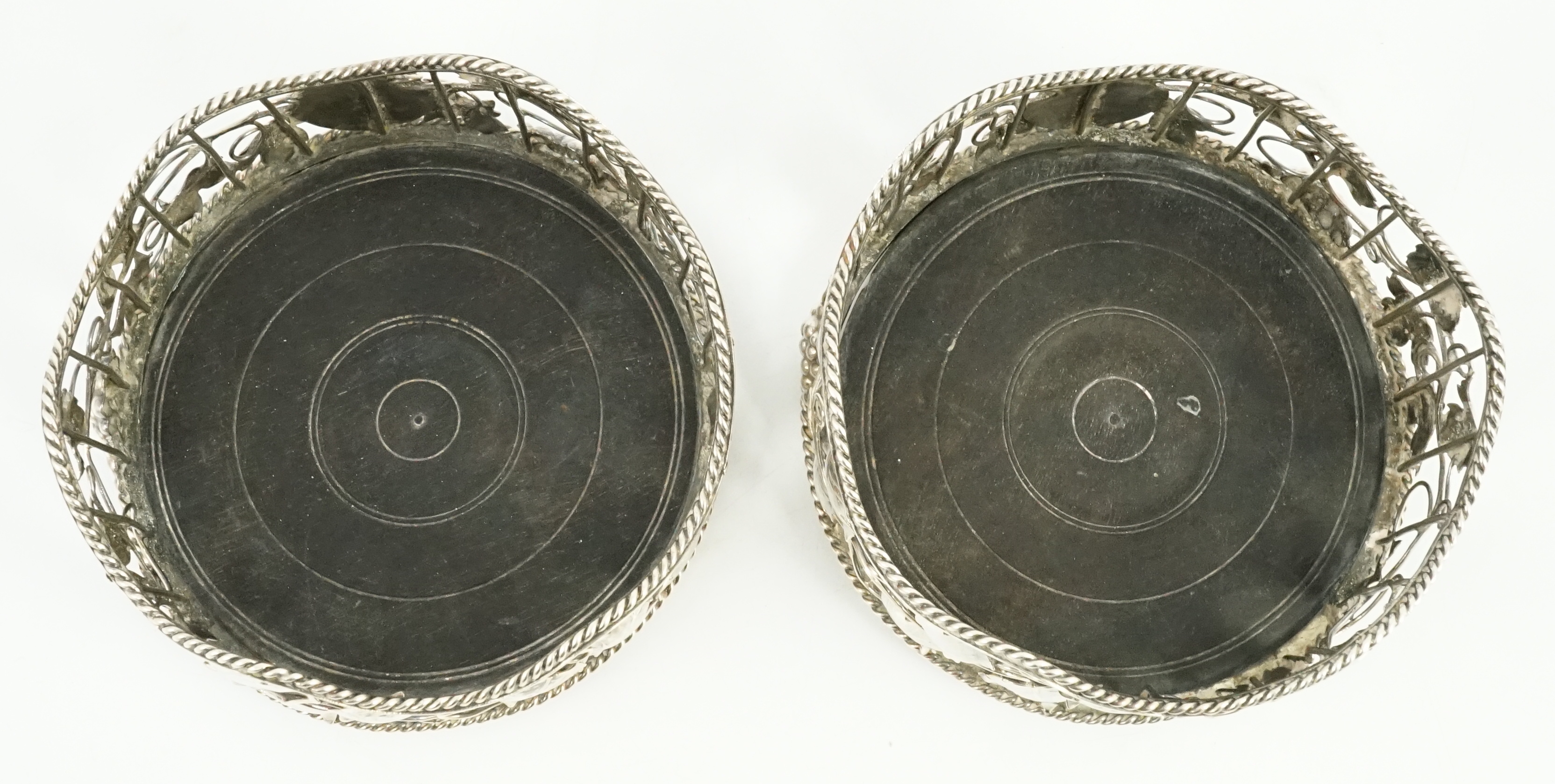 A pair of George III silver mounted wine coasters, by William Plummer